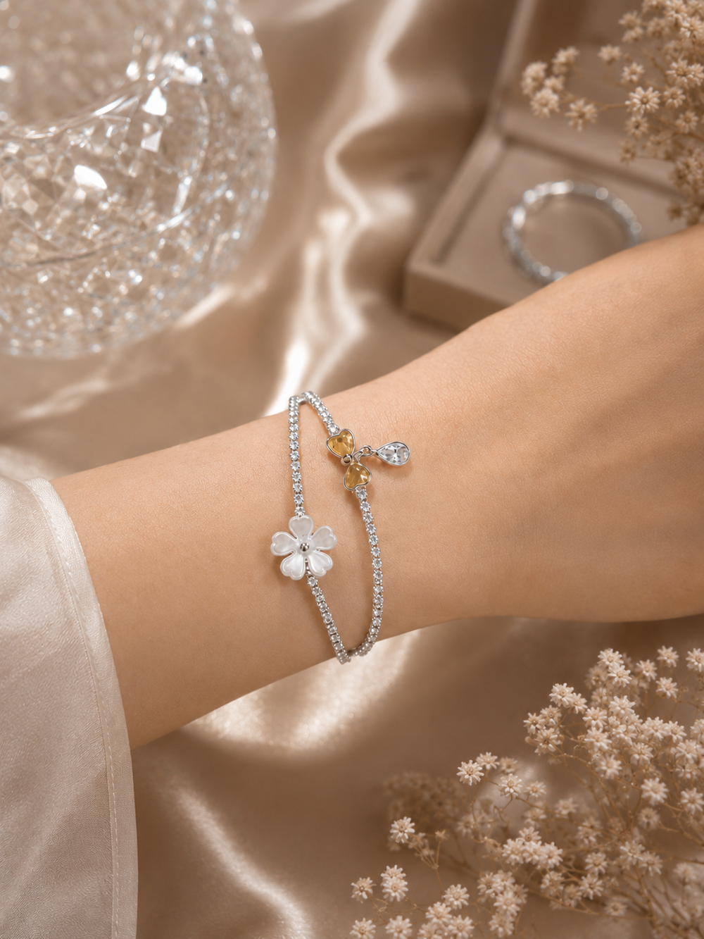White flower and bow crystal bracelet set styled on wrist